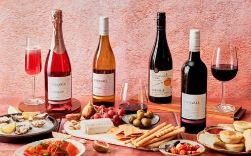 Selection of some of the best bottles of Edenvale wine on a tabletop with antipasto platters