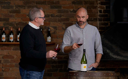 Two men at a wine tasting