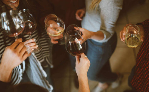 People clinking with wine