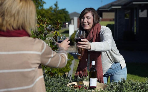 Women clincking with wine