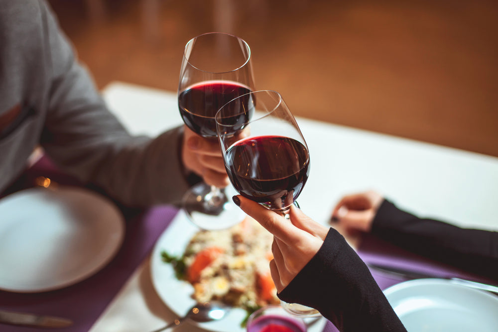 clinking with red wine
