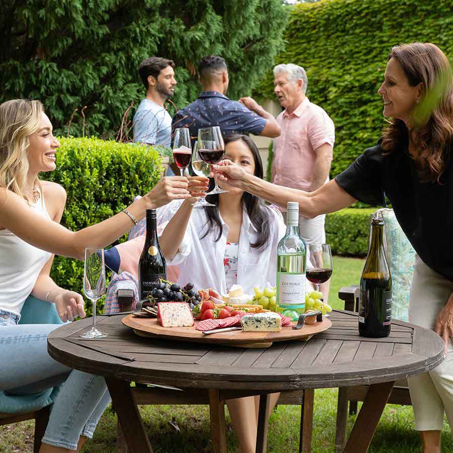 People enjoying red and white wine together