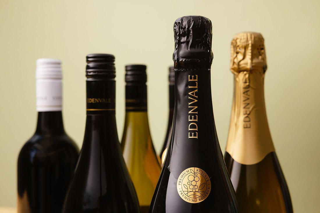 Close-up shot of the necks of Edenvale wine bottles, with non-alcoholic sparkling in the foreground