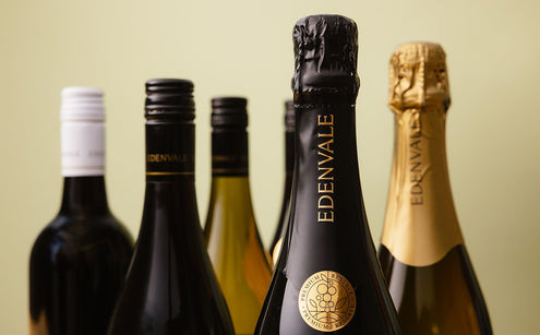Close-up shot of the necks of Edenvale wine bottles, with non-alcoholic sparkling in the foreground