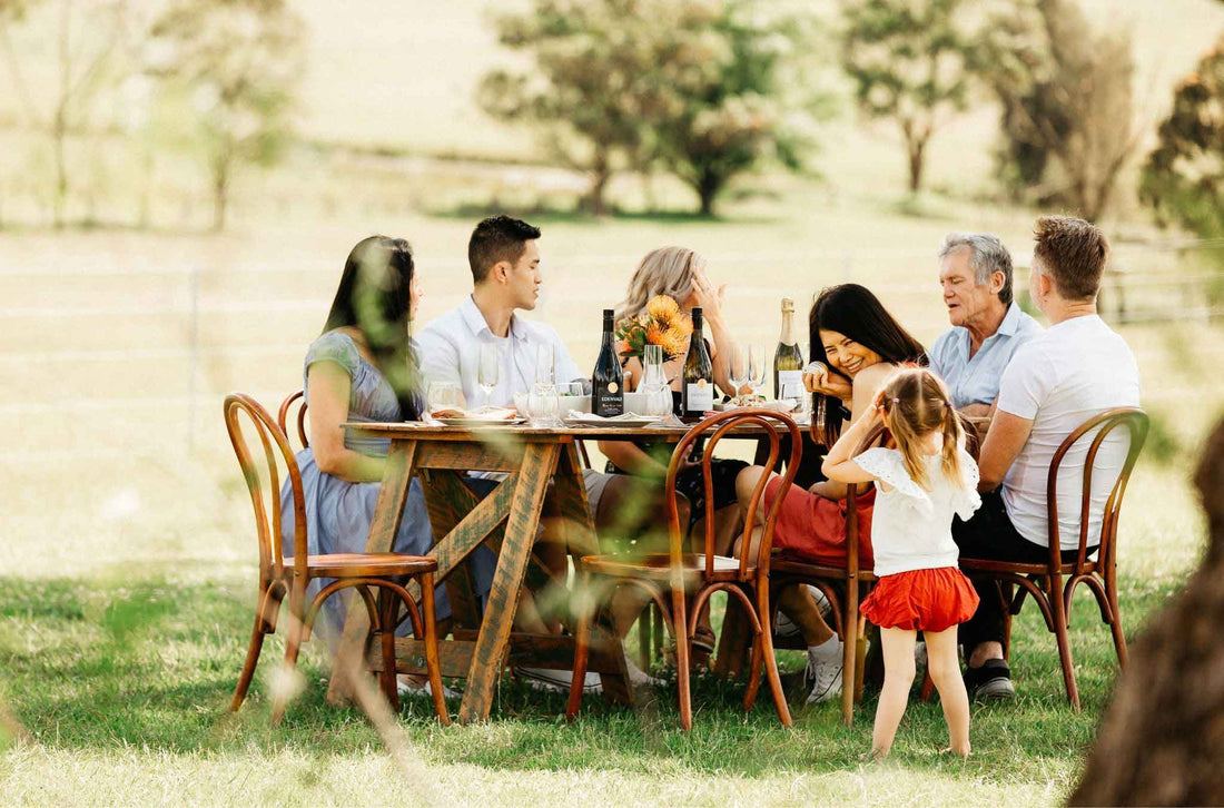 family having a dinner party outside