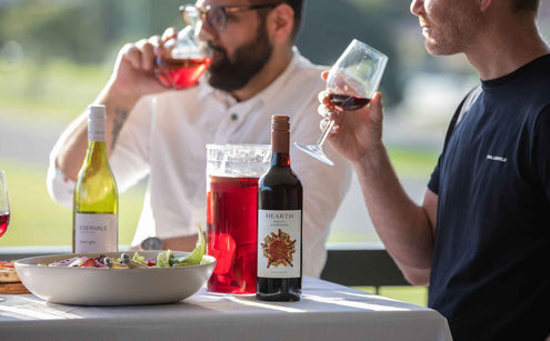 Two men drinking hearth wine